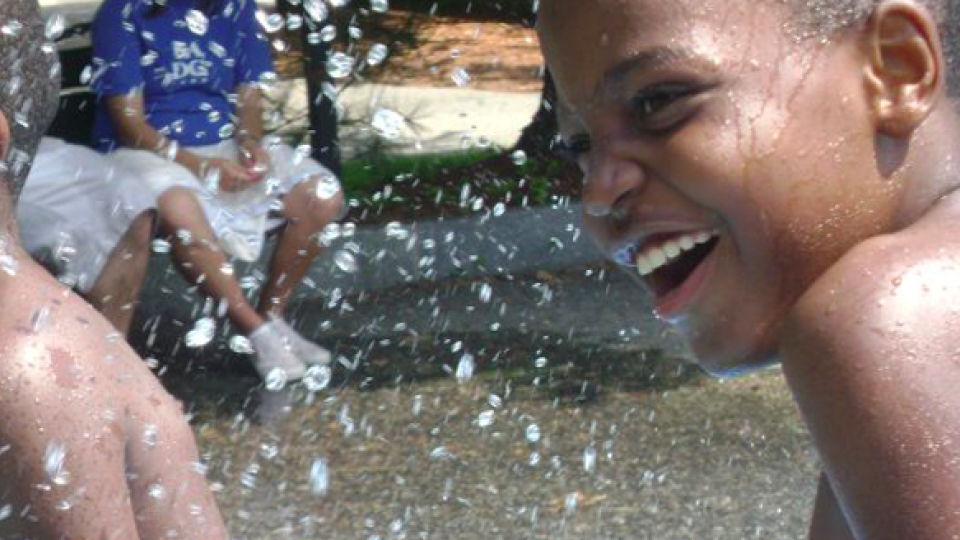 Boys playing in the splash pool