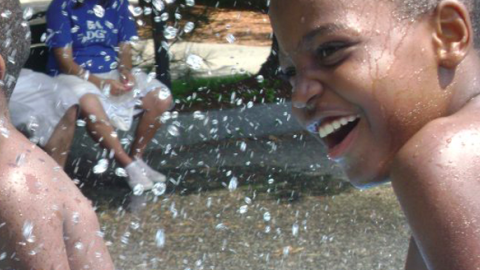 Boys playing in the splash pool